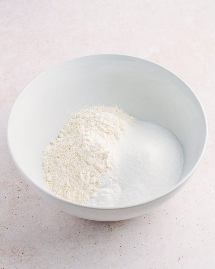 Flour, sugar, baking powder, and salt in a mixing bowl.