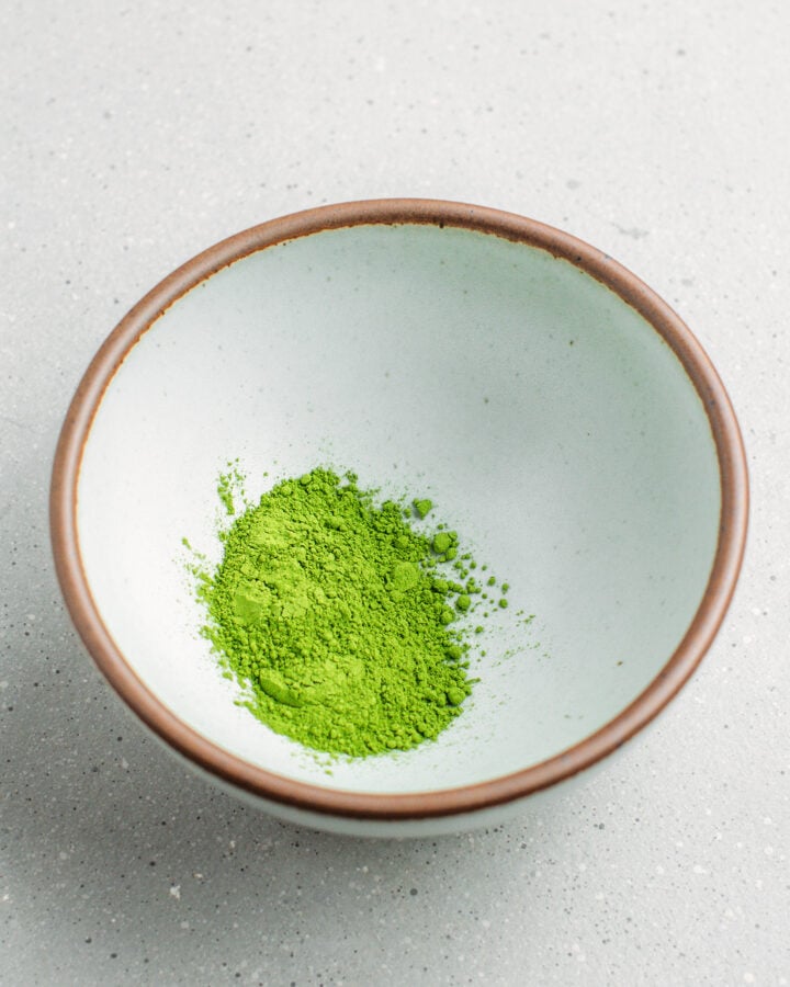 Matcha powder in a small bowl.