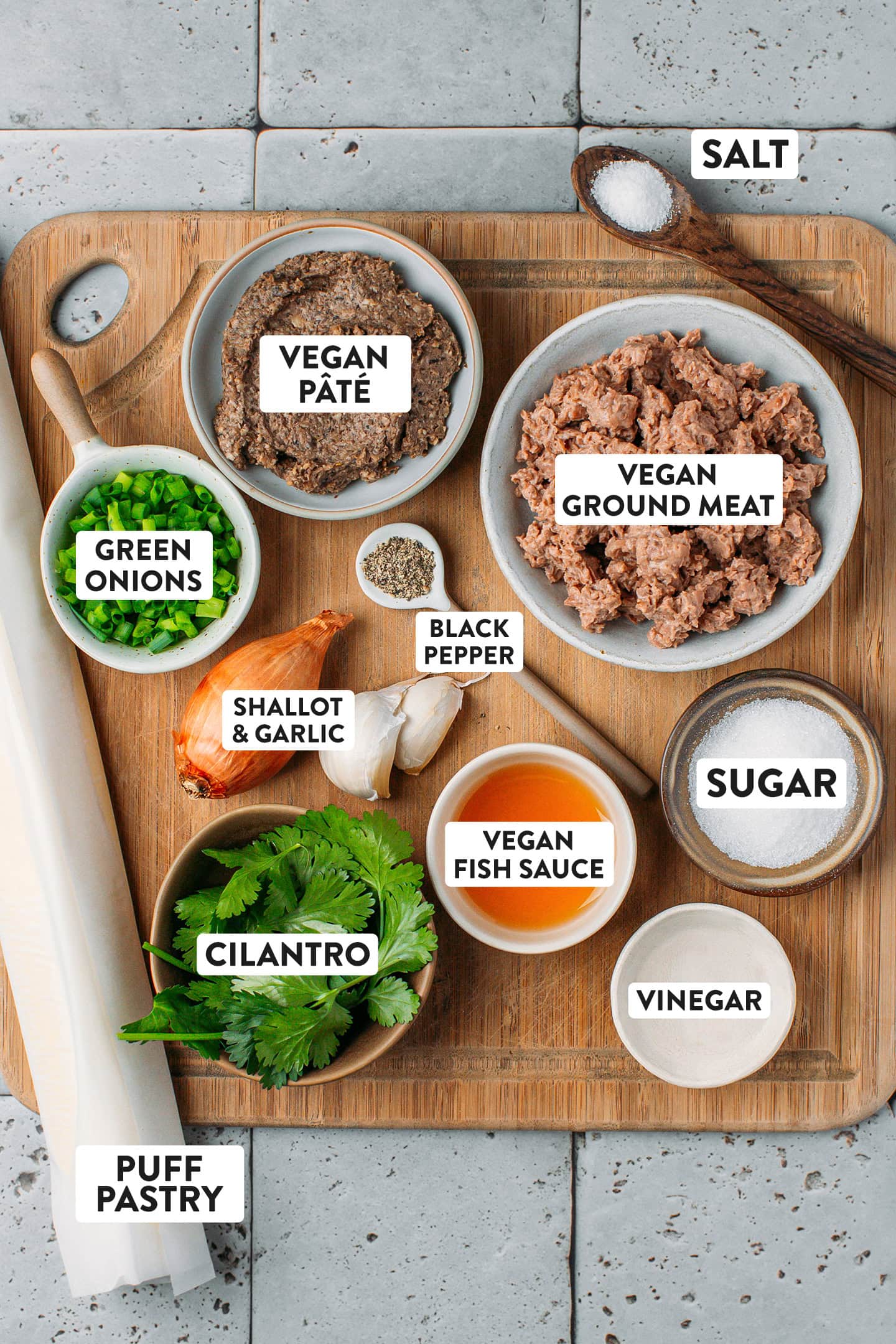 Ingredients like vegan ground meat, pâté, garlic, shallots, and fresh herbs.