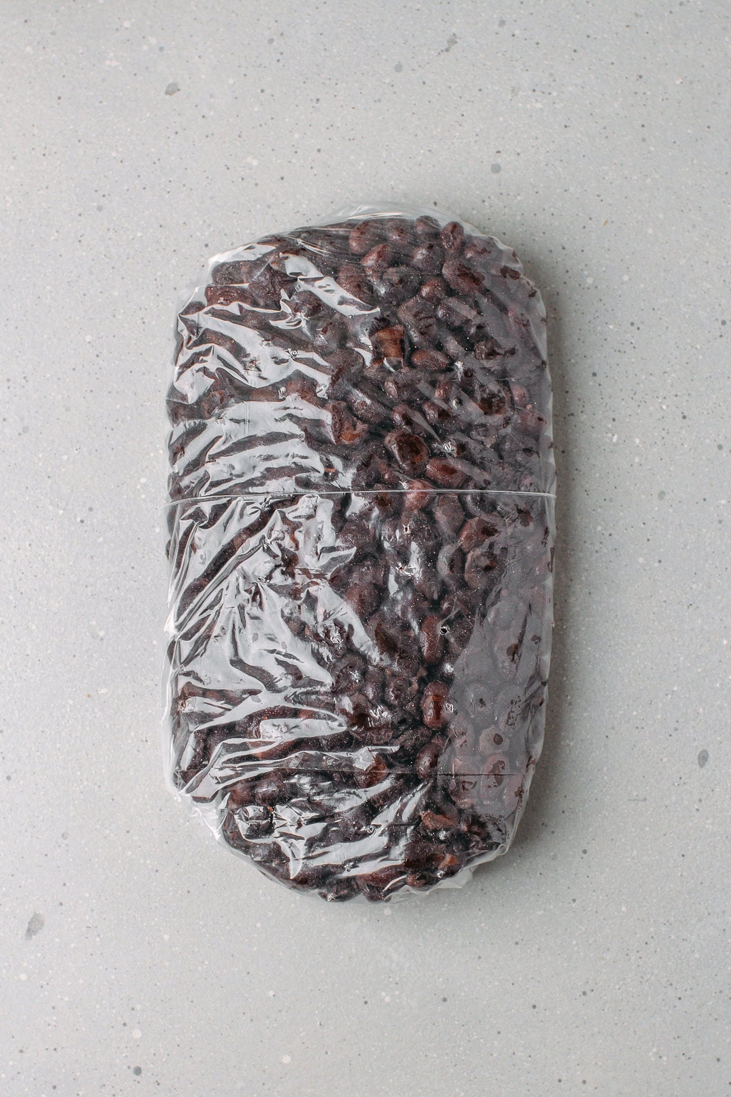 Freezer bag filled with cooked black beans.