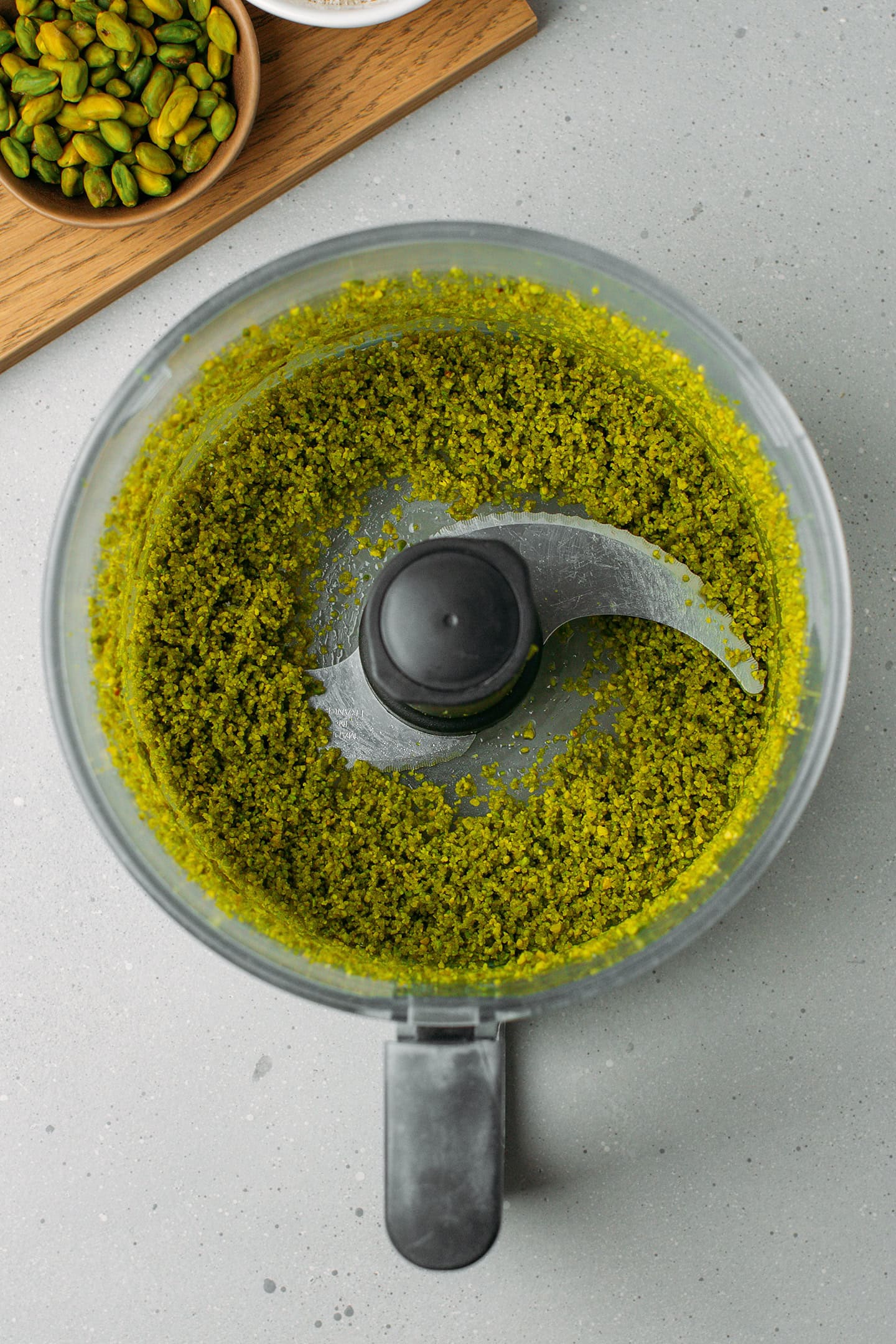 Processed pistachio in a food processor.
