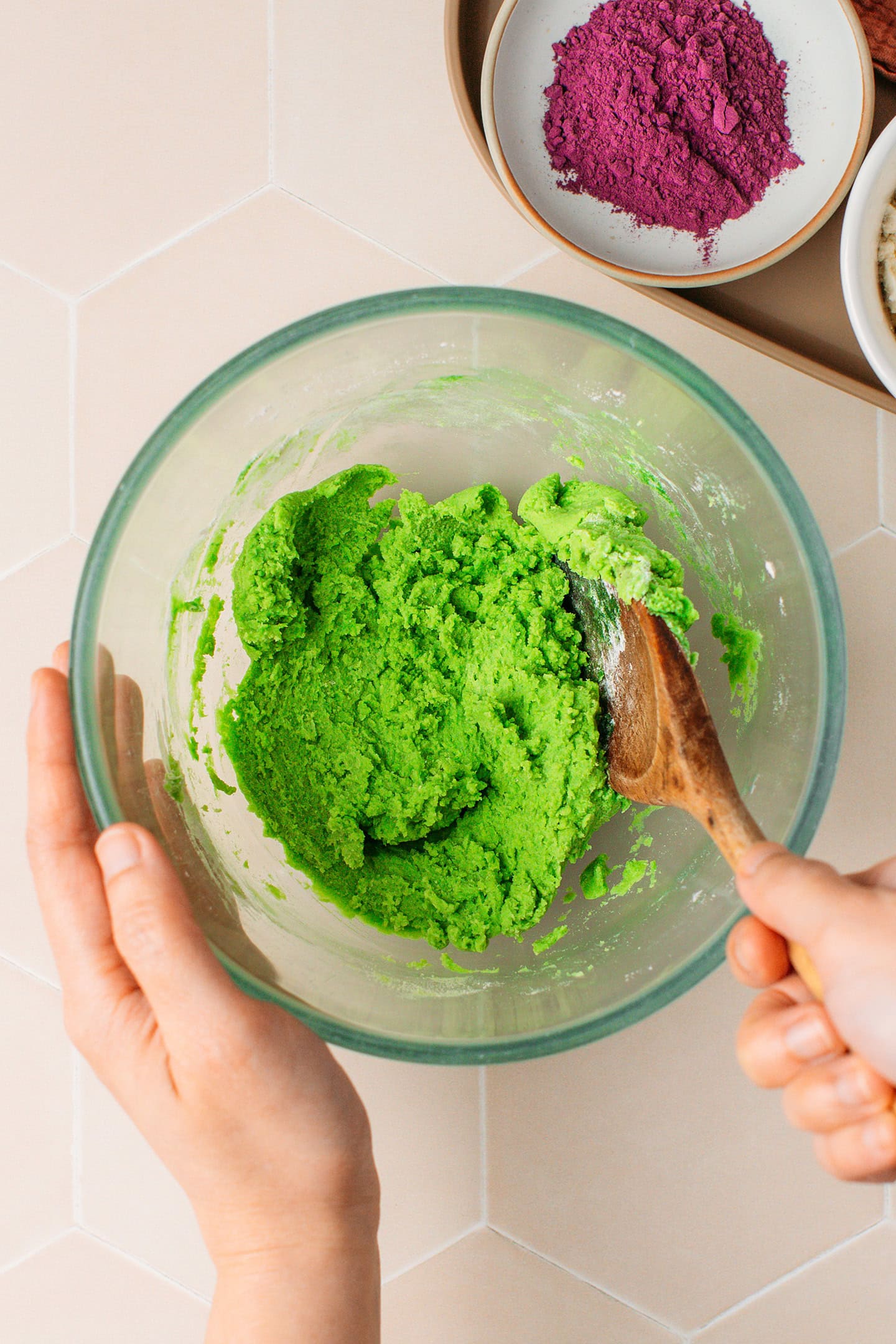 Mixing pandan cookie dough in a mixing bowl.