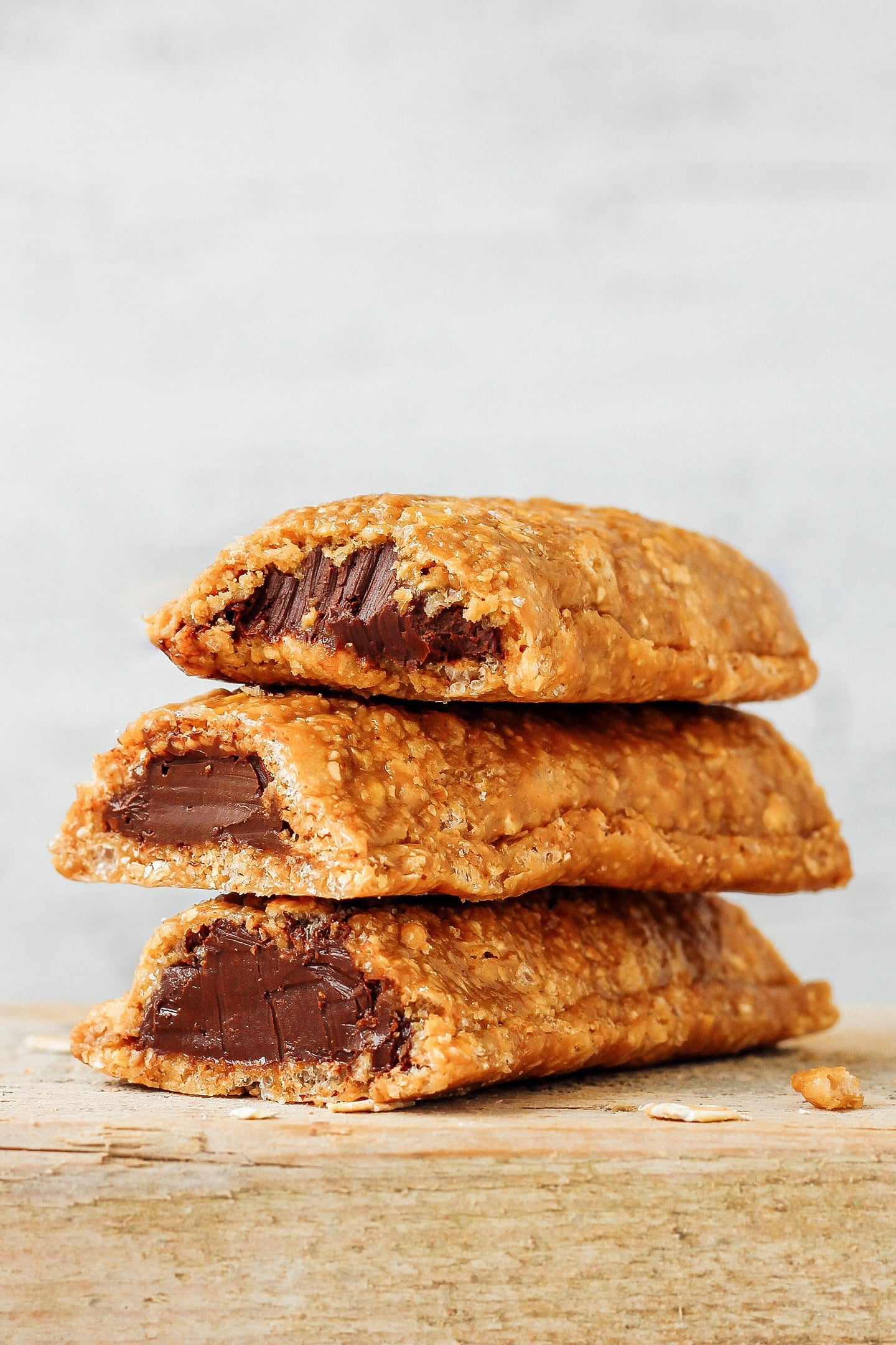 Three soft hazelnut butter filled granola bars stacked.
