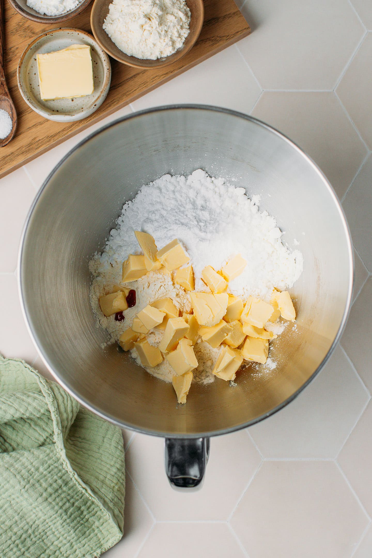 Flour, powdered sugar, and butter in a stand mixer.