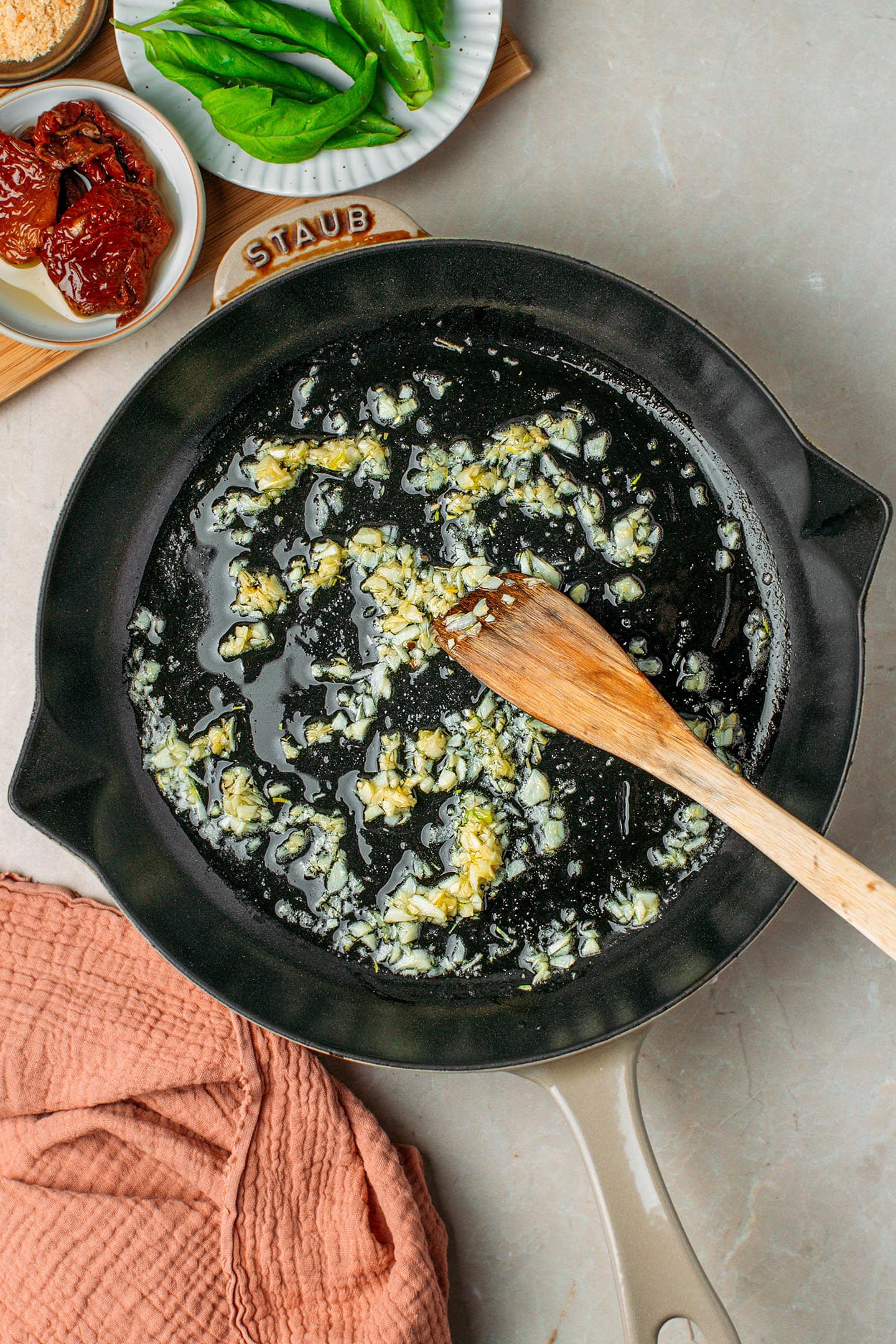 Sautéed minced garlic in a skillet.