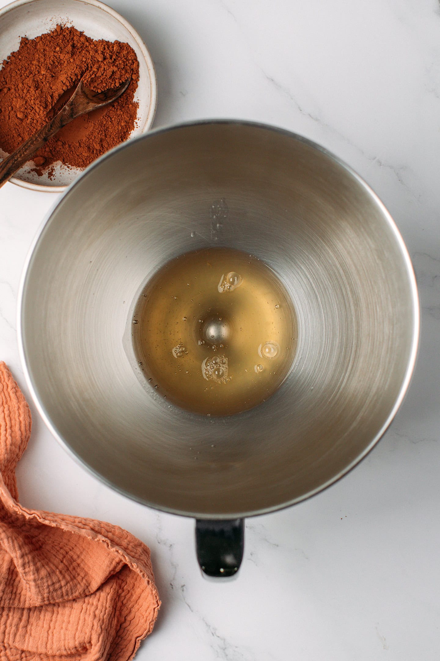 Aquafaba in the bowl of a stand mixer.
