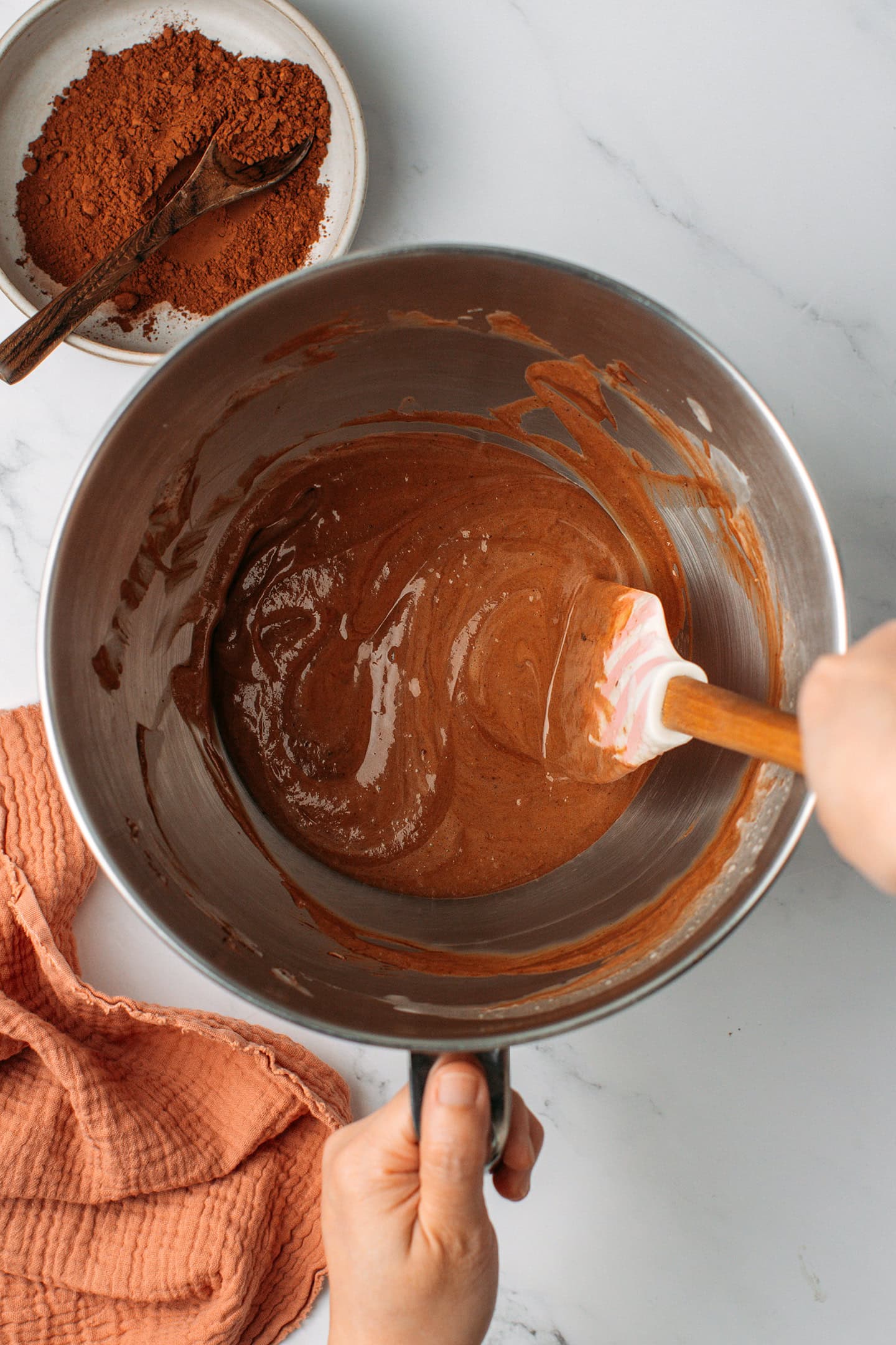 Chocolate hazelnut mousse in the bowl of a stand mixer.