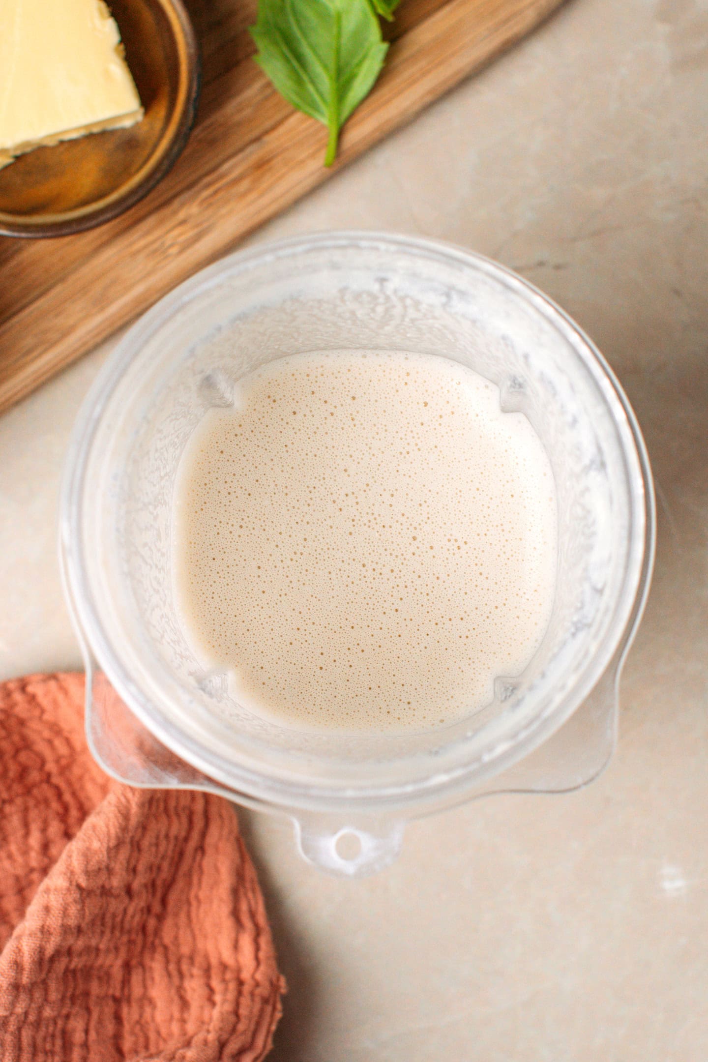 Blended cashew cream in a blender.