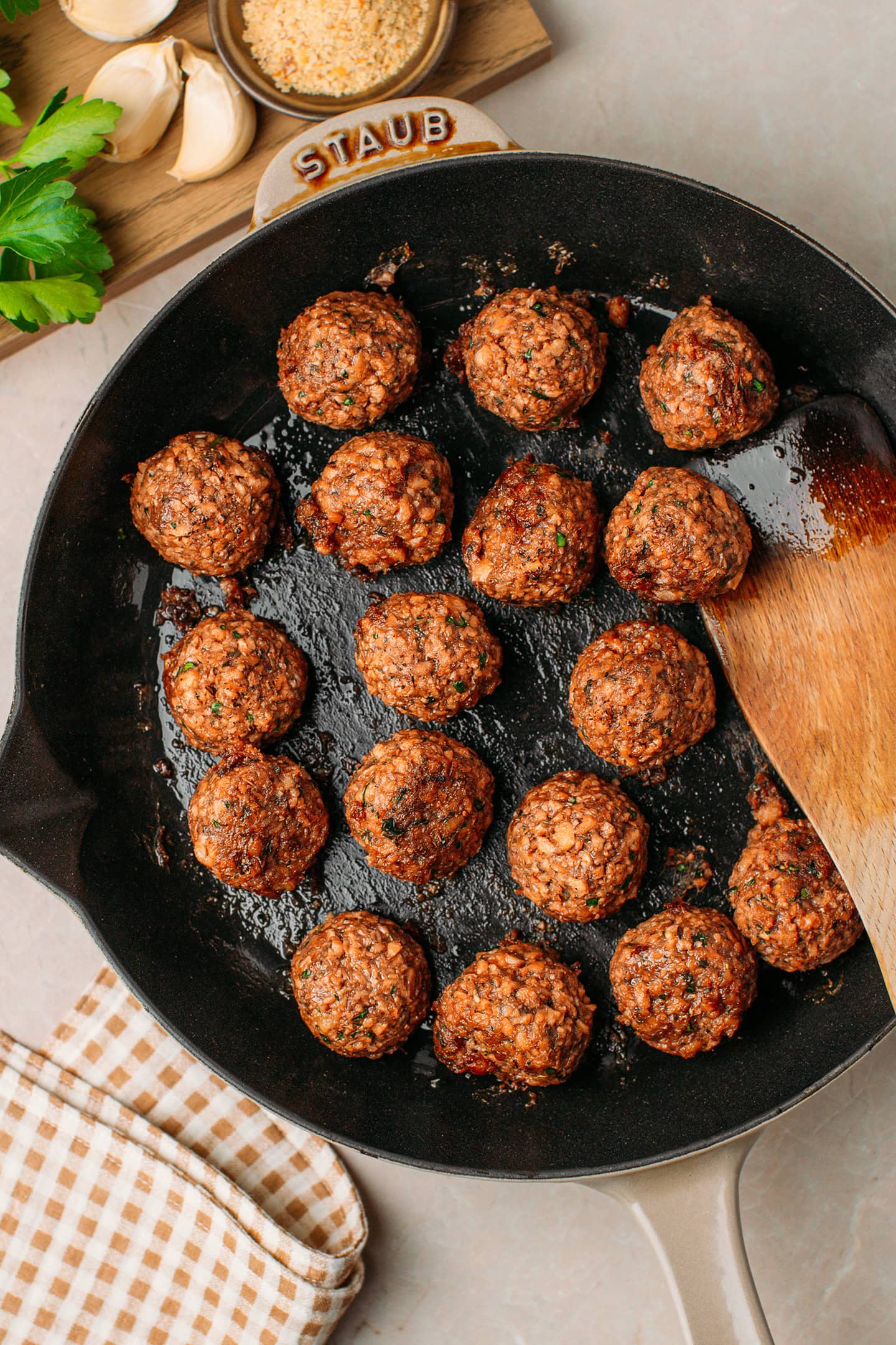 Sautéed vegan meatballs in a skillet.