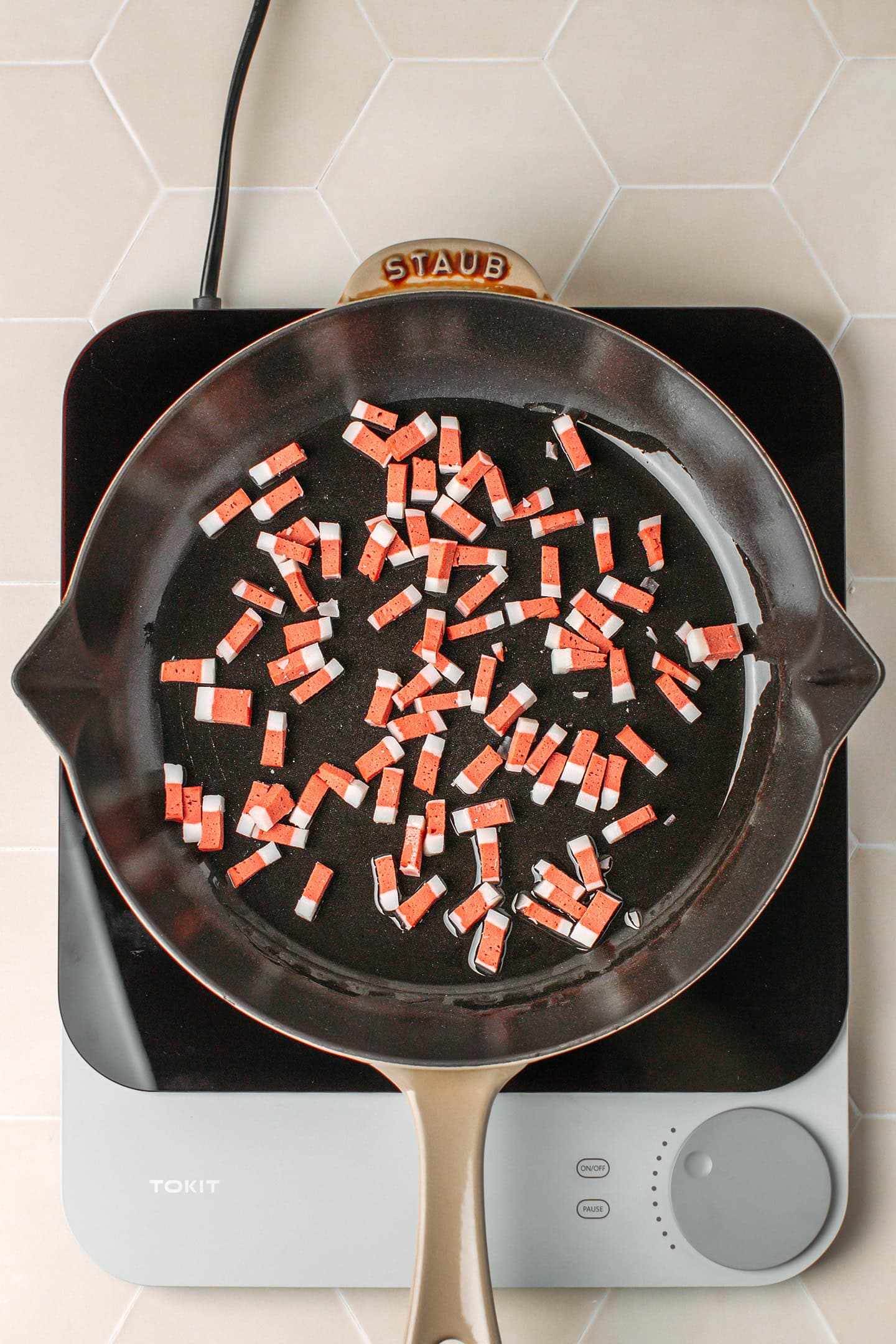 Vegan bacon bits in a skillet.