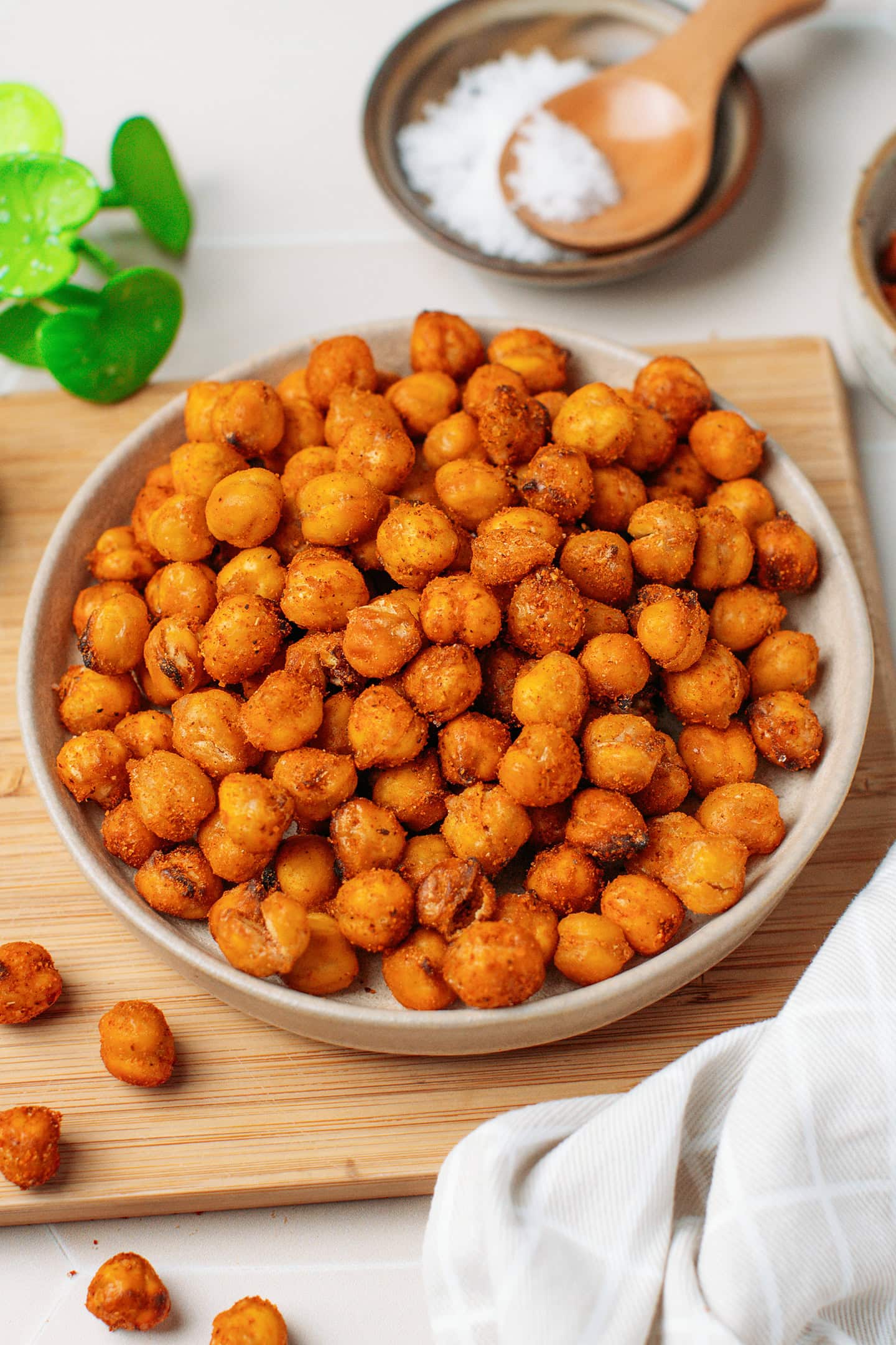 Golden brown air fryer chickpeas on a small plate.