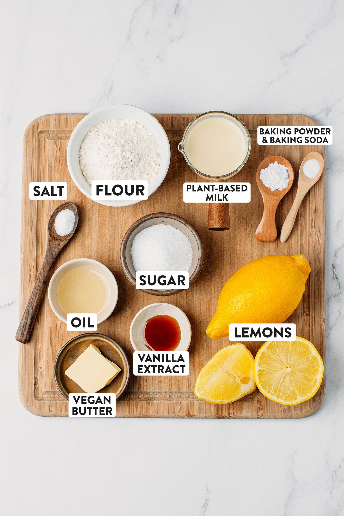 Ingredients like flour, sugar, lemons, vegan butter, and vanilla extract.