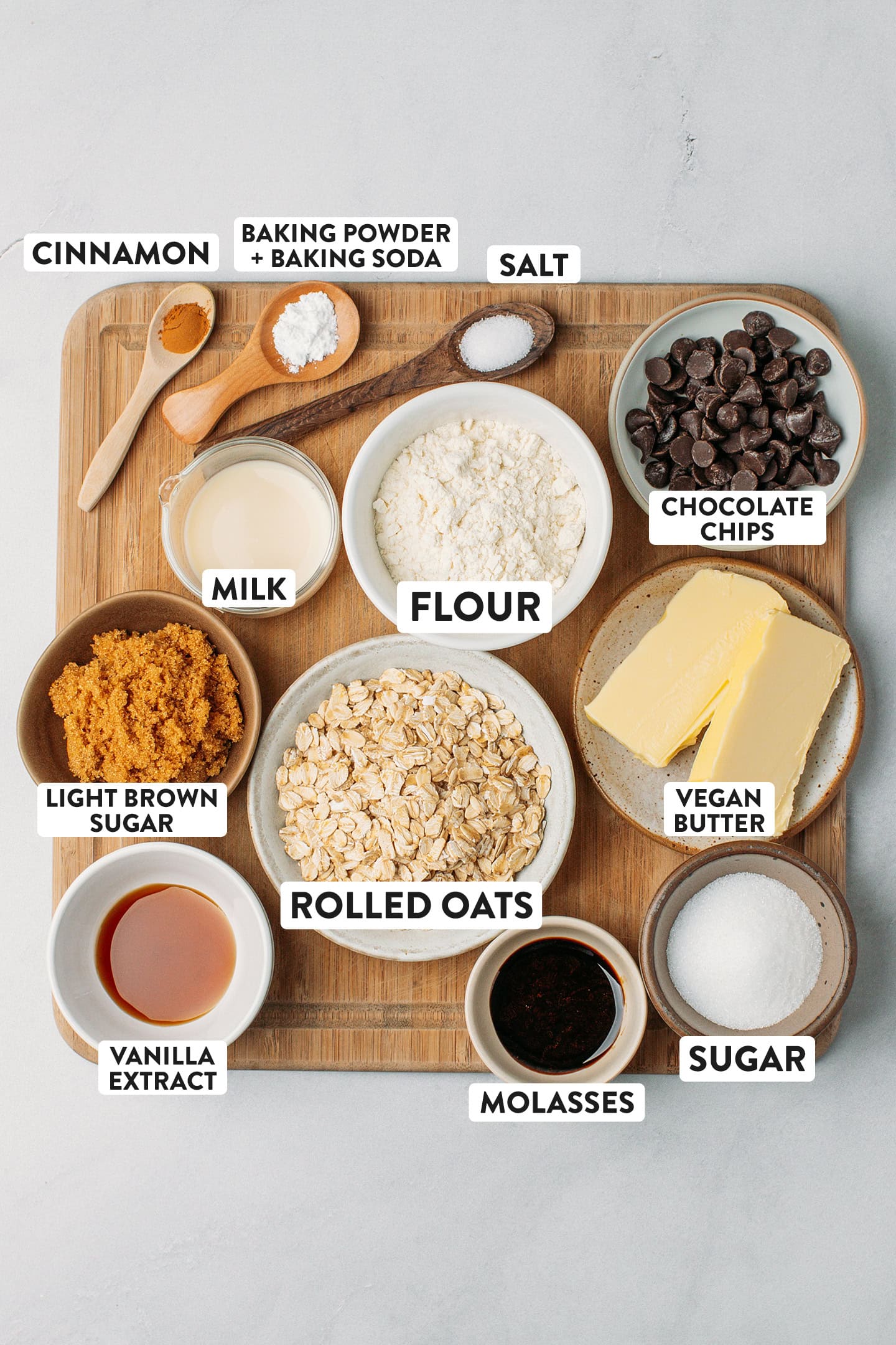 Ingredients like flour, rolled oats, vegan butter, light brown sugar, and chocolate chips.