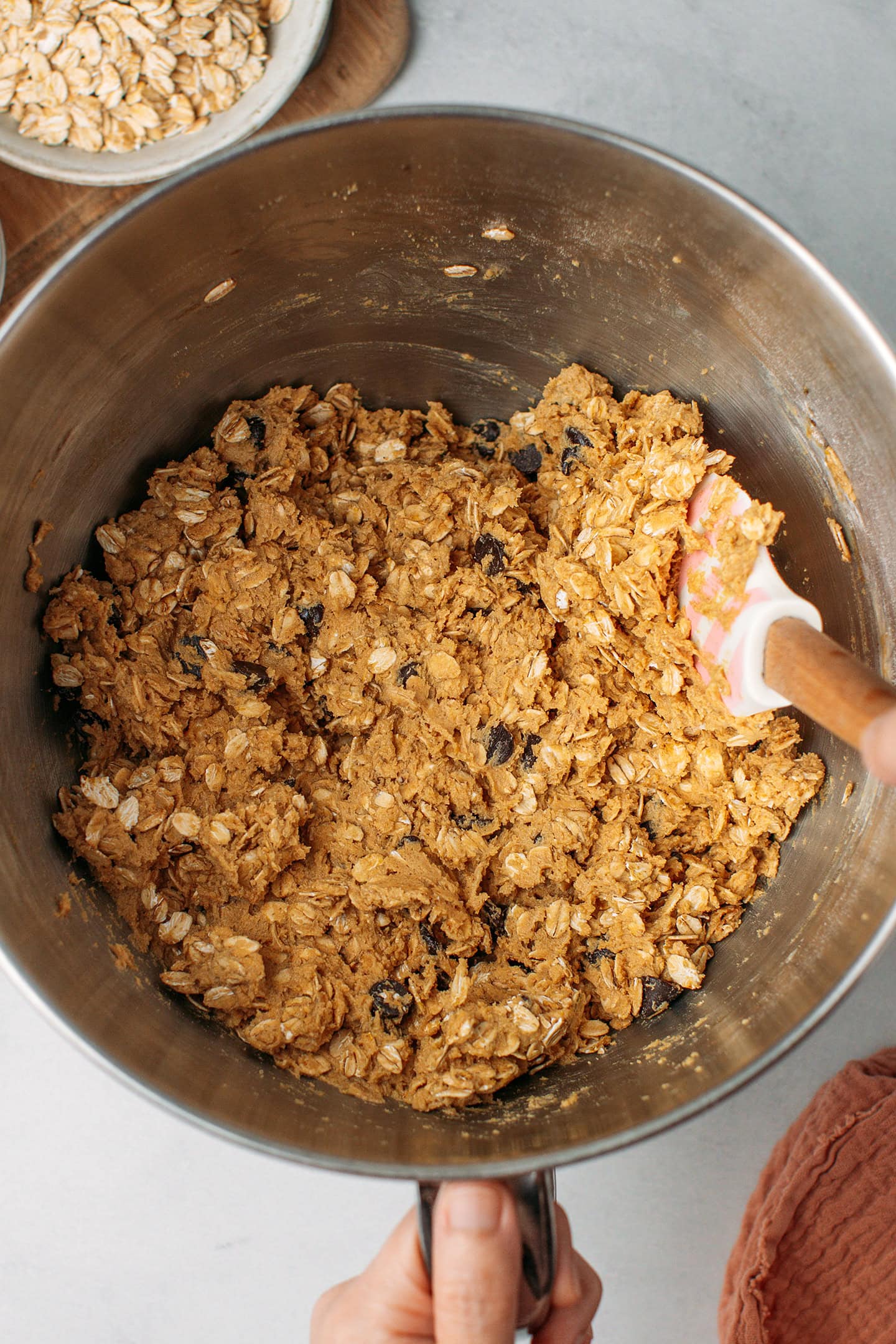 Oatmeal chocolate chip cookie dough in a bowl.