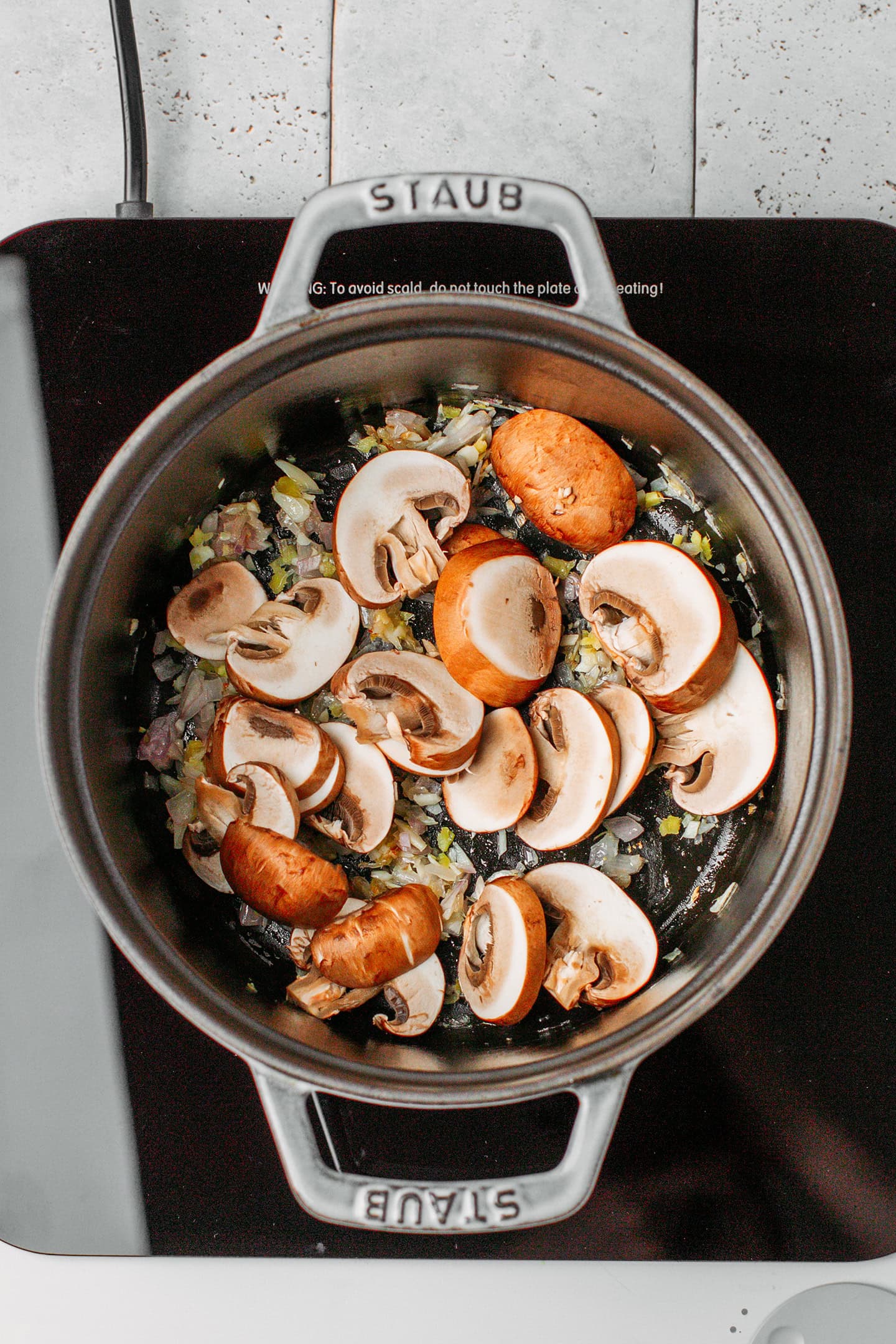 Sliced mushrooms in a pot.