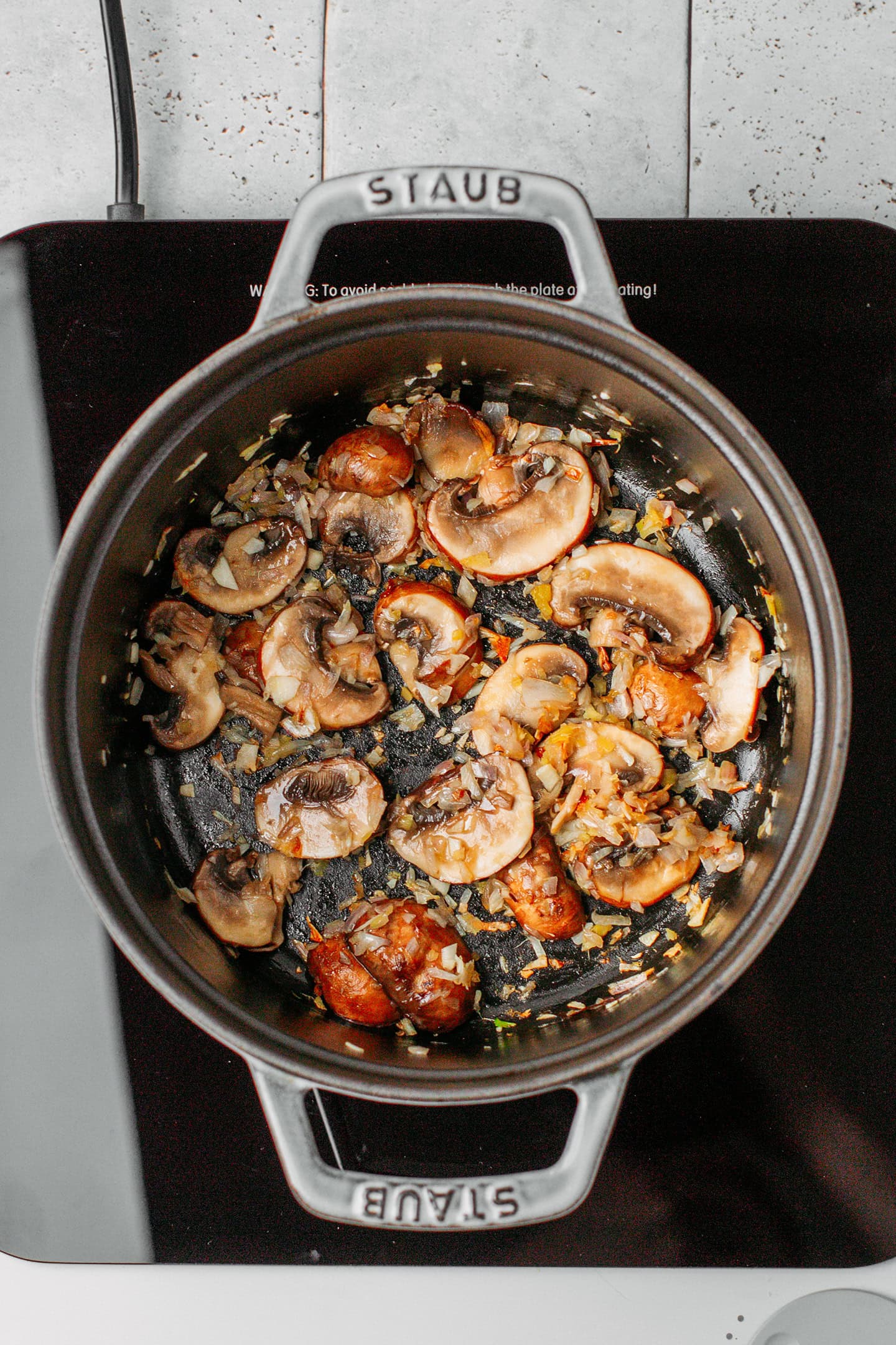 Sautéed mushrooms in a pot.