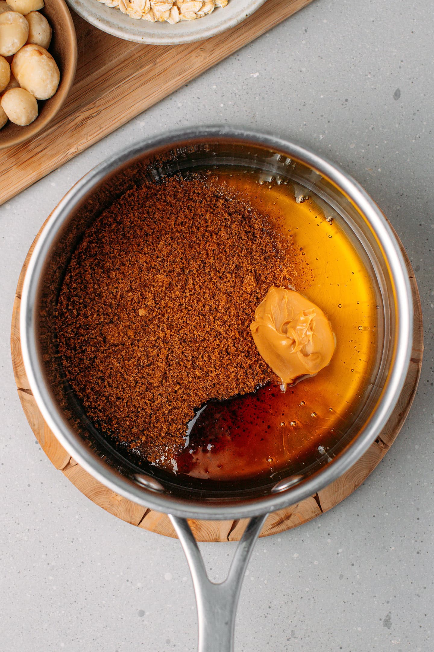 Brown rice syrup, coconut sugar, and peanut butter in a saucepan.