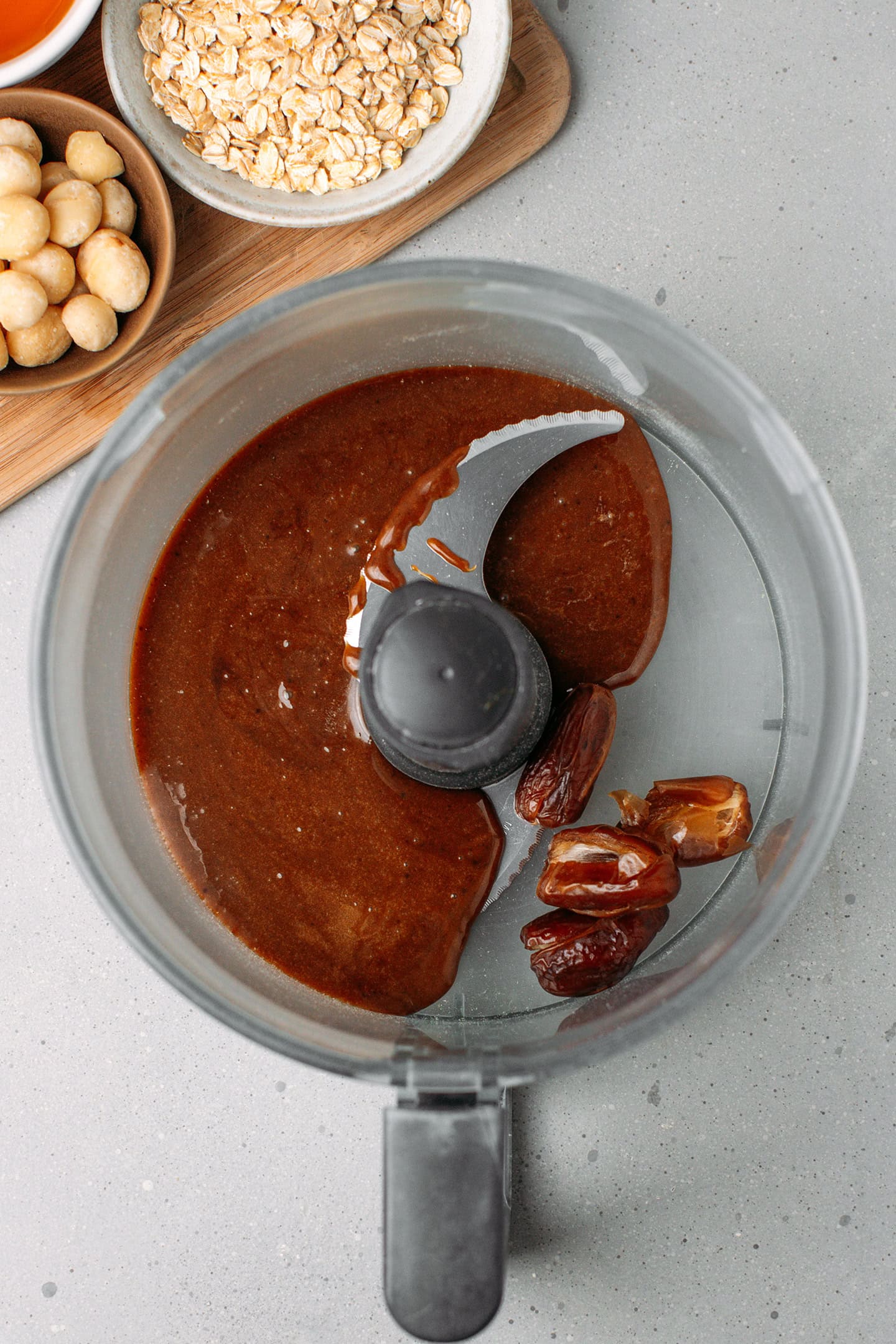Melted brown rice syrup and dates in a food processor.