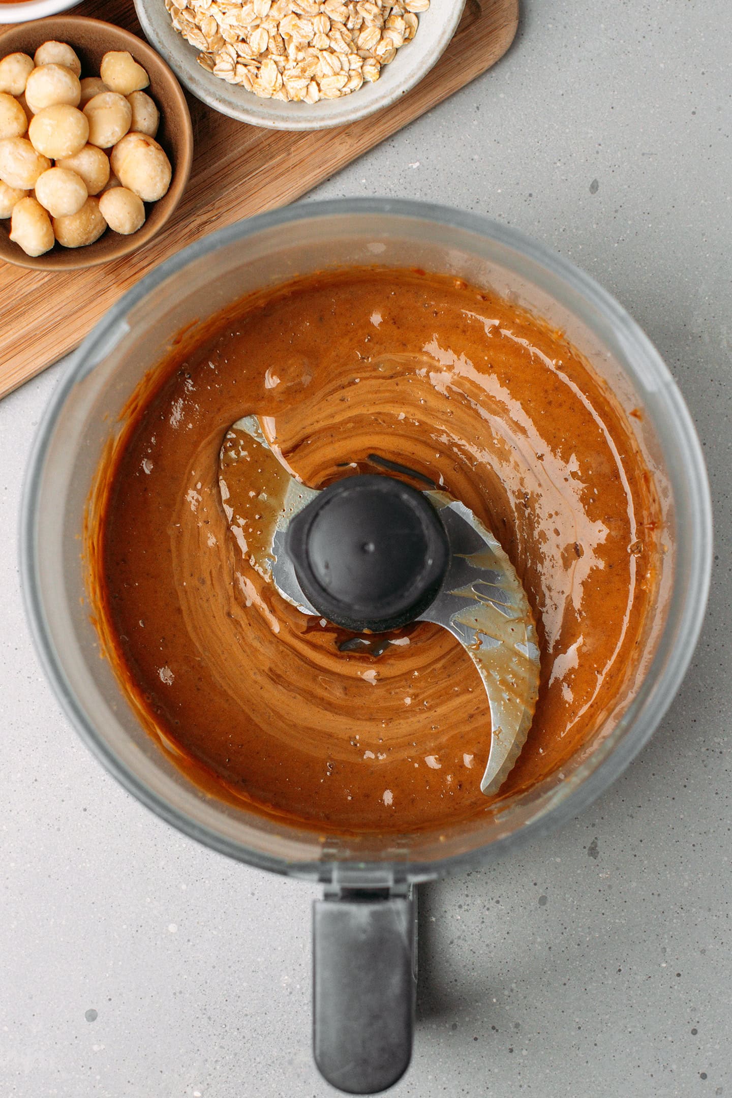 Brown rice syrup mixed with dates in a food processor.