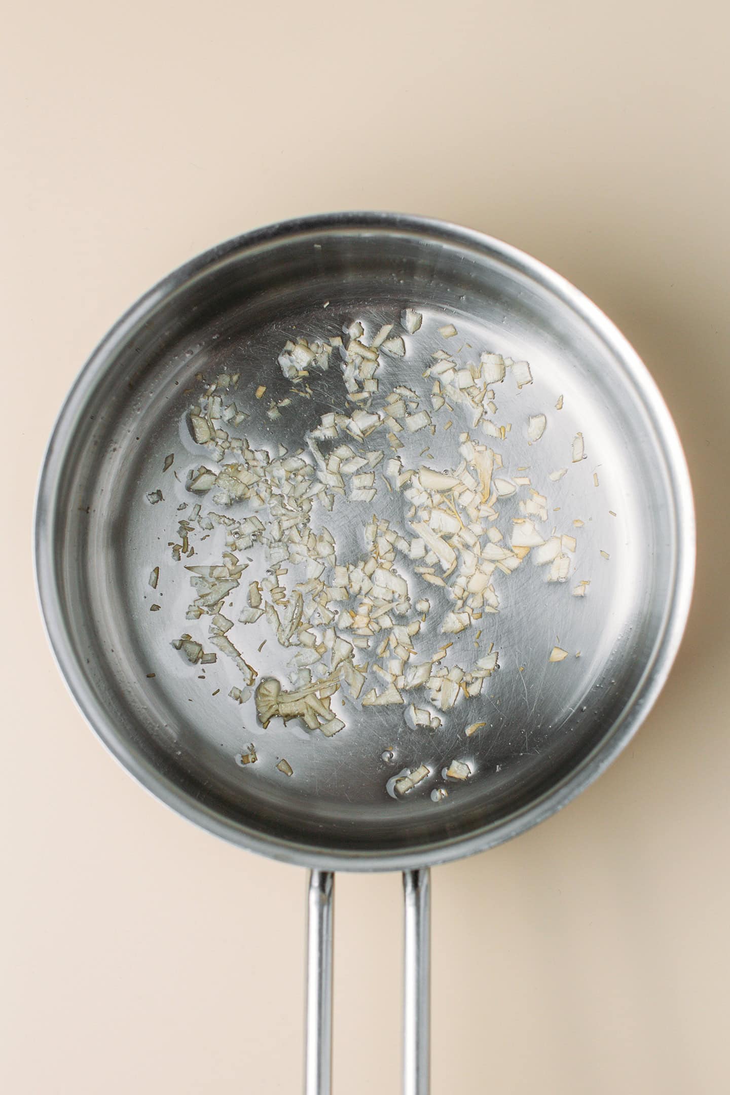 Sautéed garlic in a saucepan.