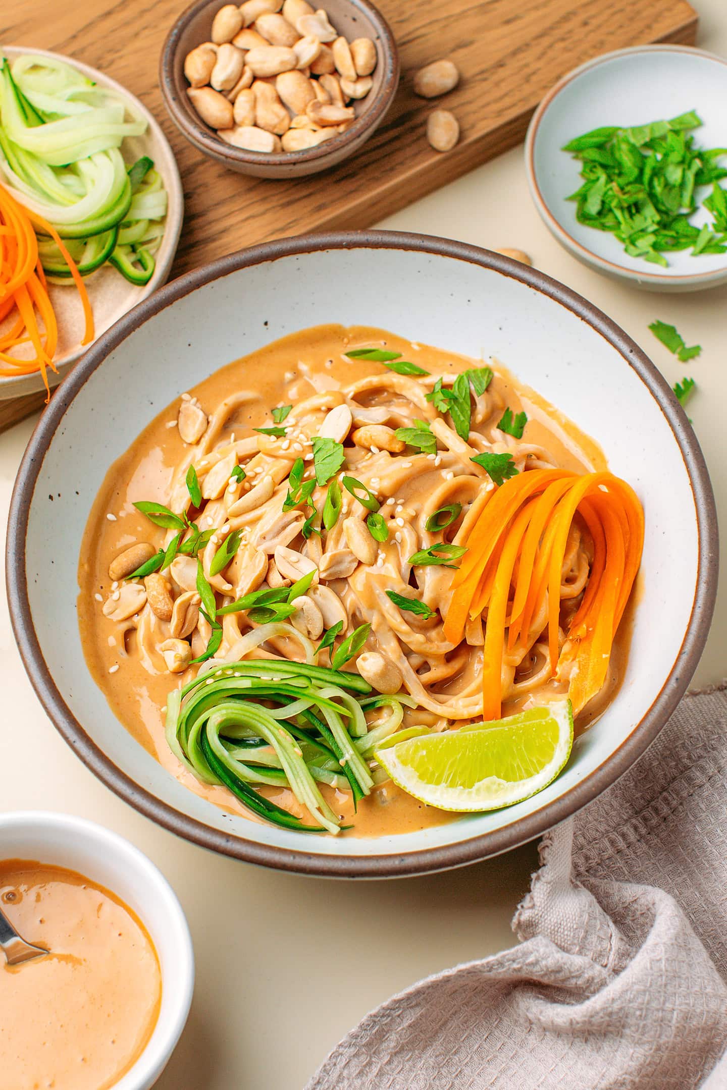 Noodles tossed with a peanut sauce and served with julienned cucumbers and carrots.