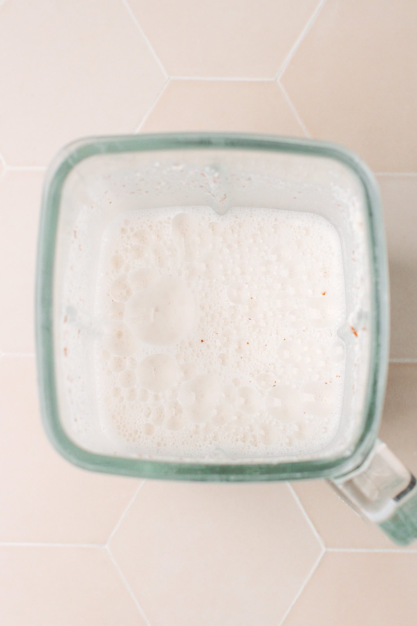 Almond and cashew milk in a blender.