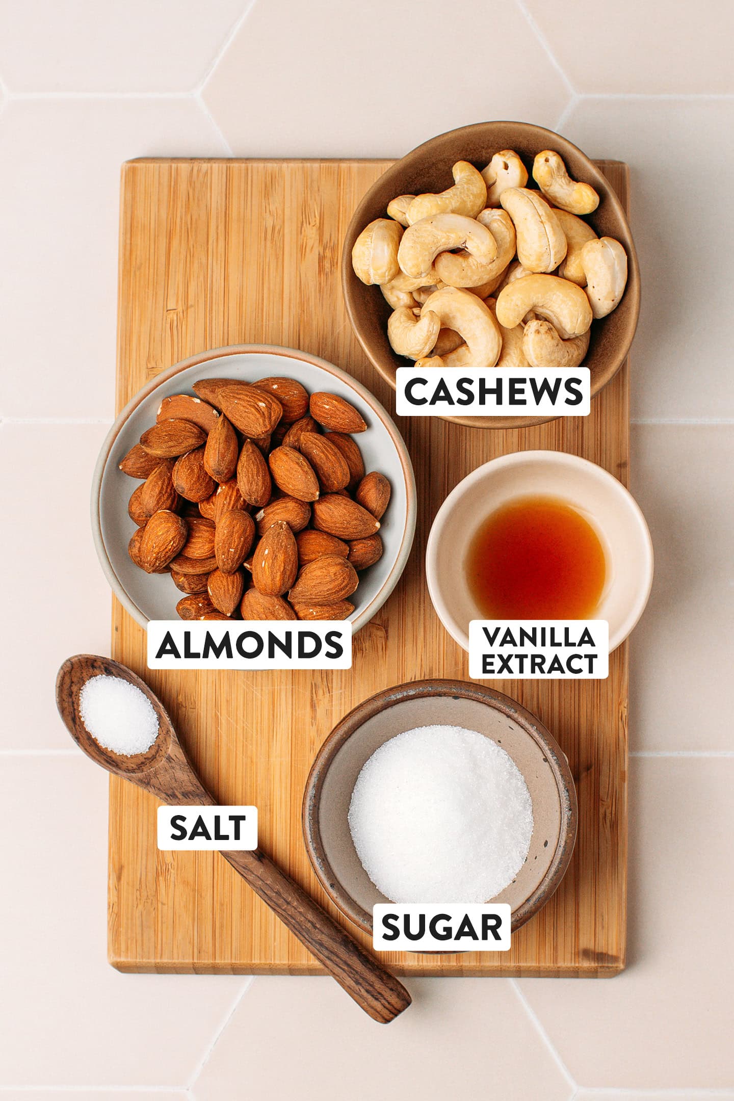 Ingredients like almonds, cashews, sugar, salt, and vanilla extract.