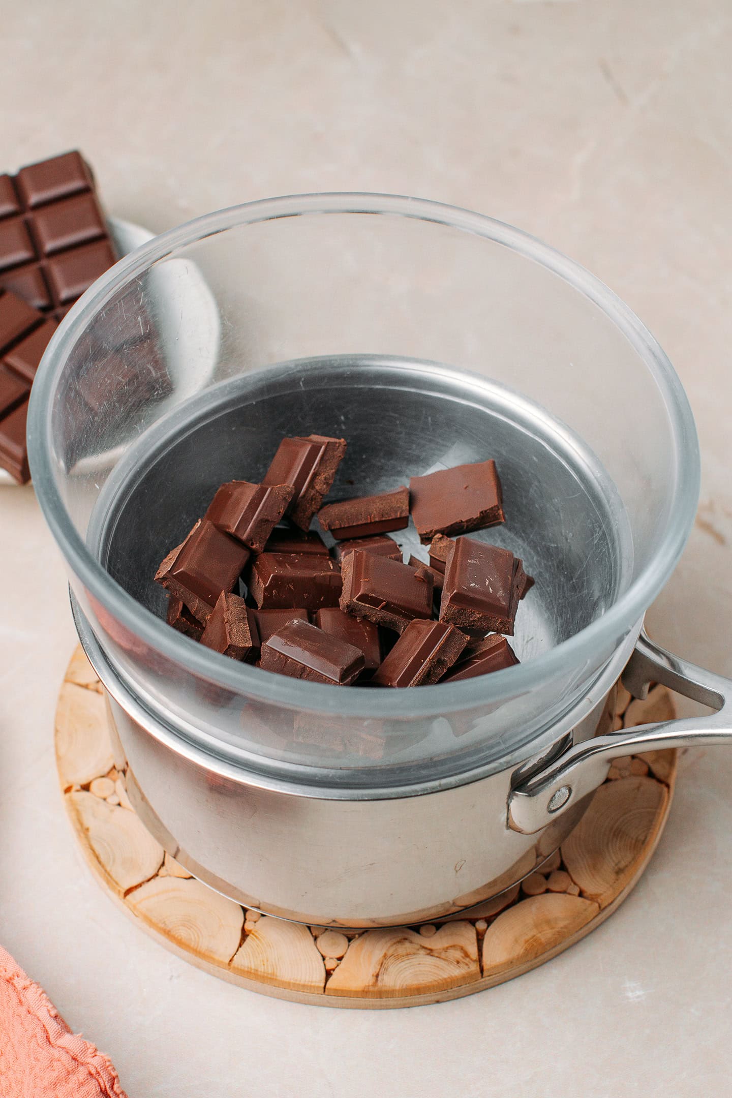 Dark chocolate chunks in a double boiler.