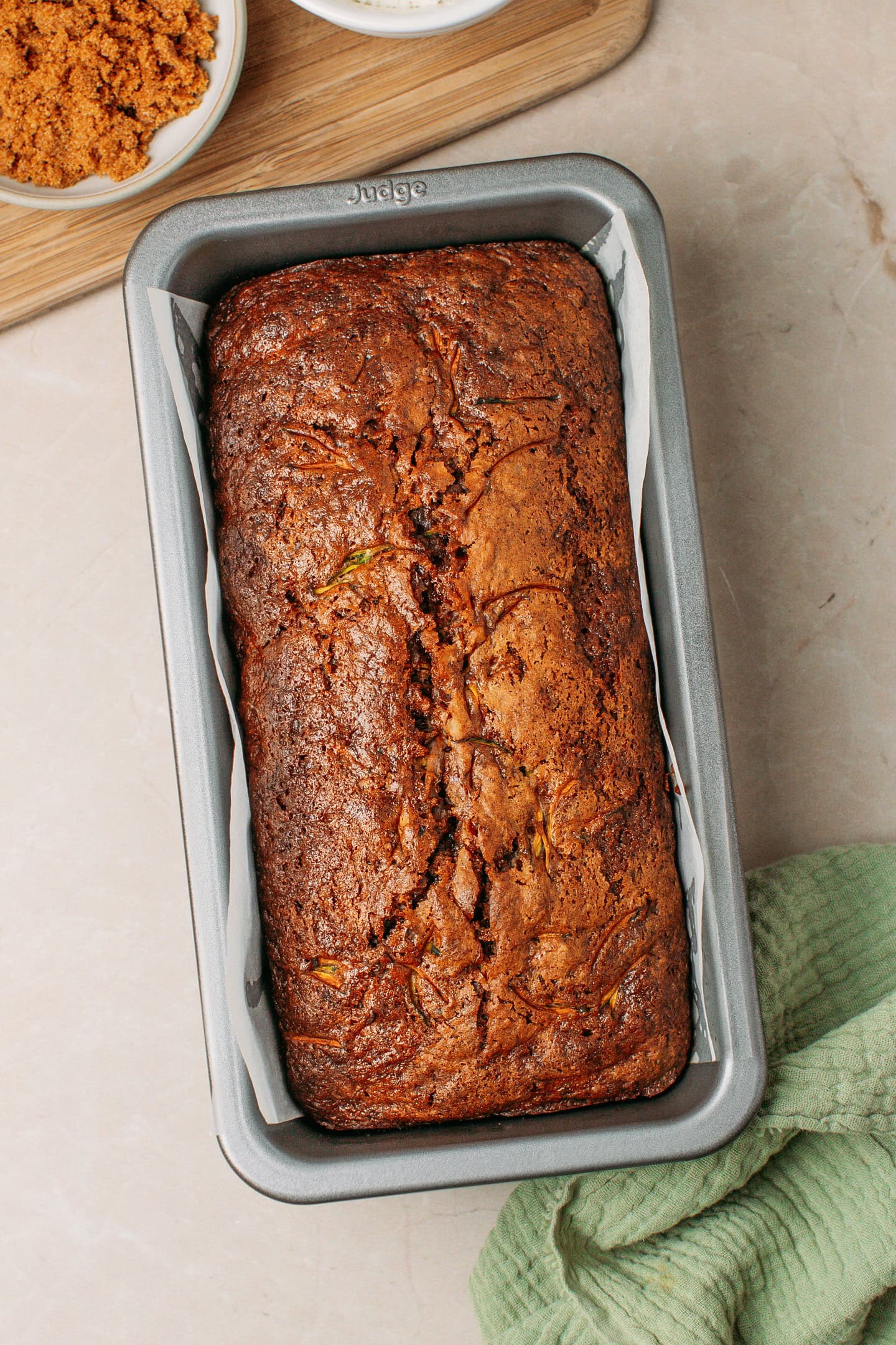 Baked zucchini bread in a loaf pan.