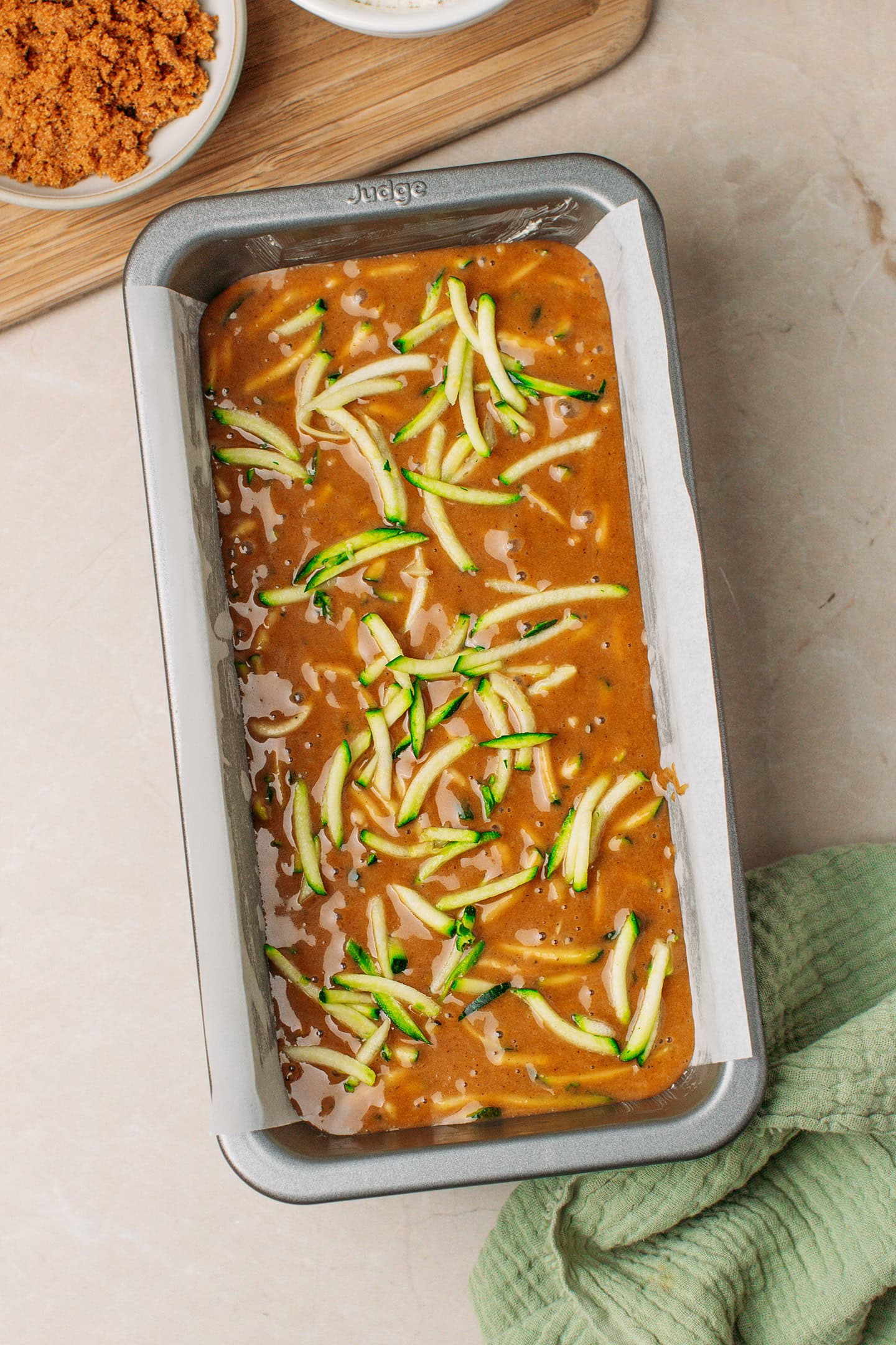 Zucchini bread batter in a loaf pan.