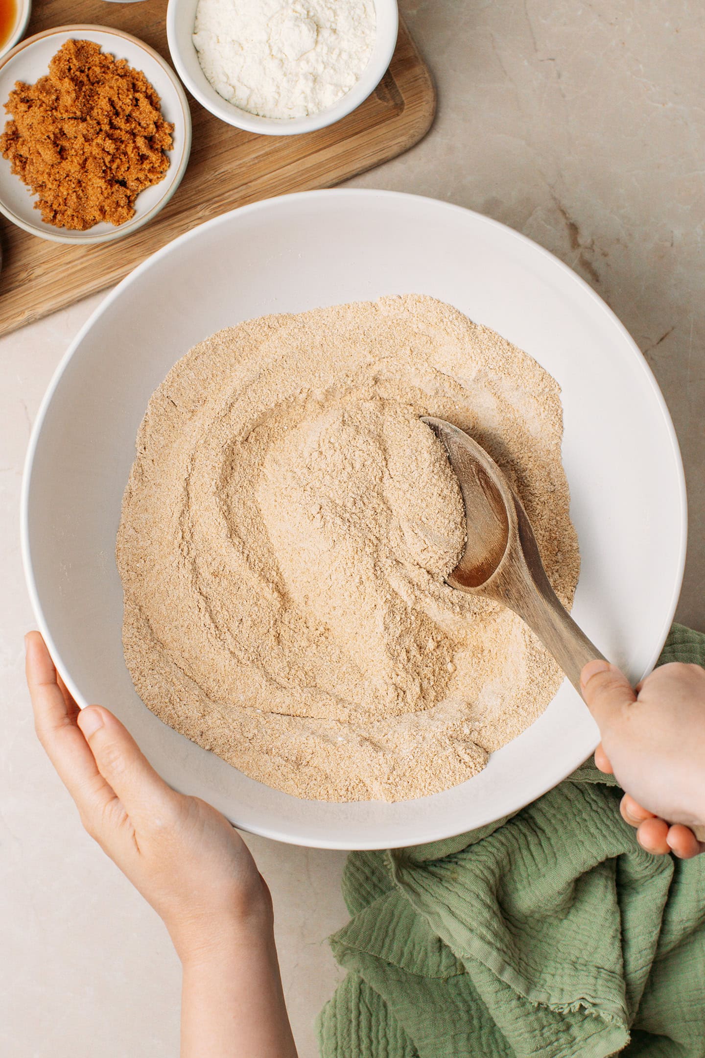 Whisking dry ingredients in a mixing bowl.