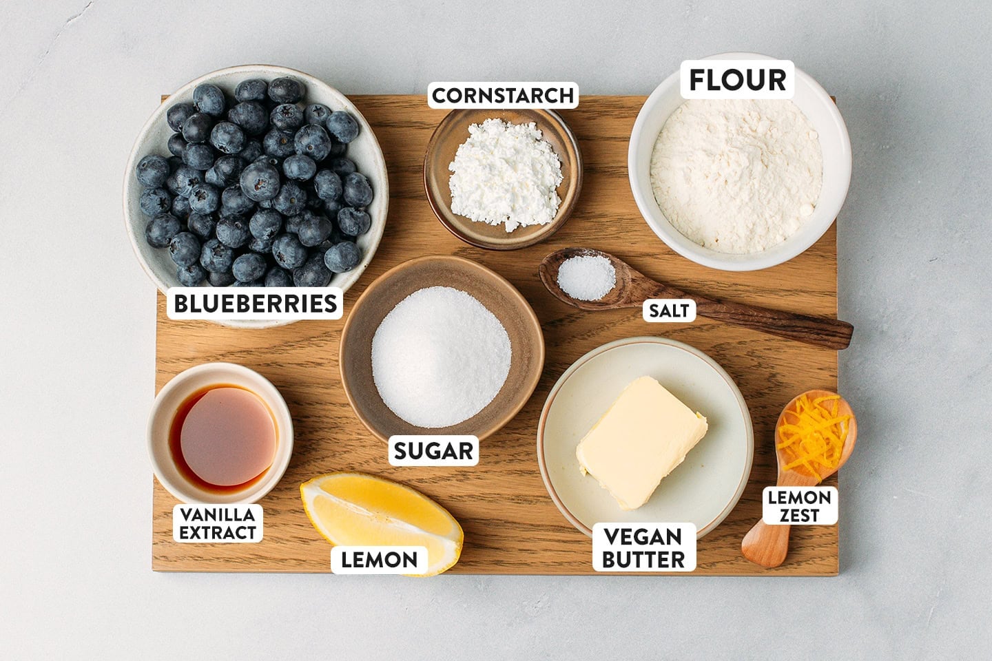Ingredients like blueberries, cornstarch, flour, vegan butter, and sugar.