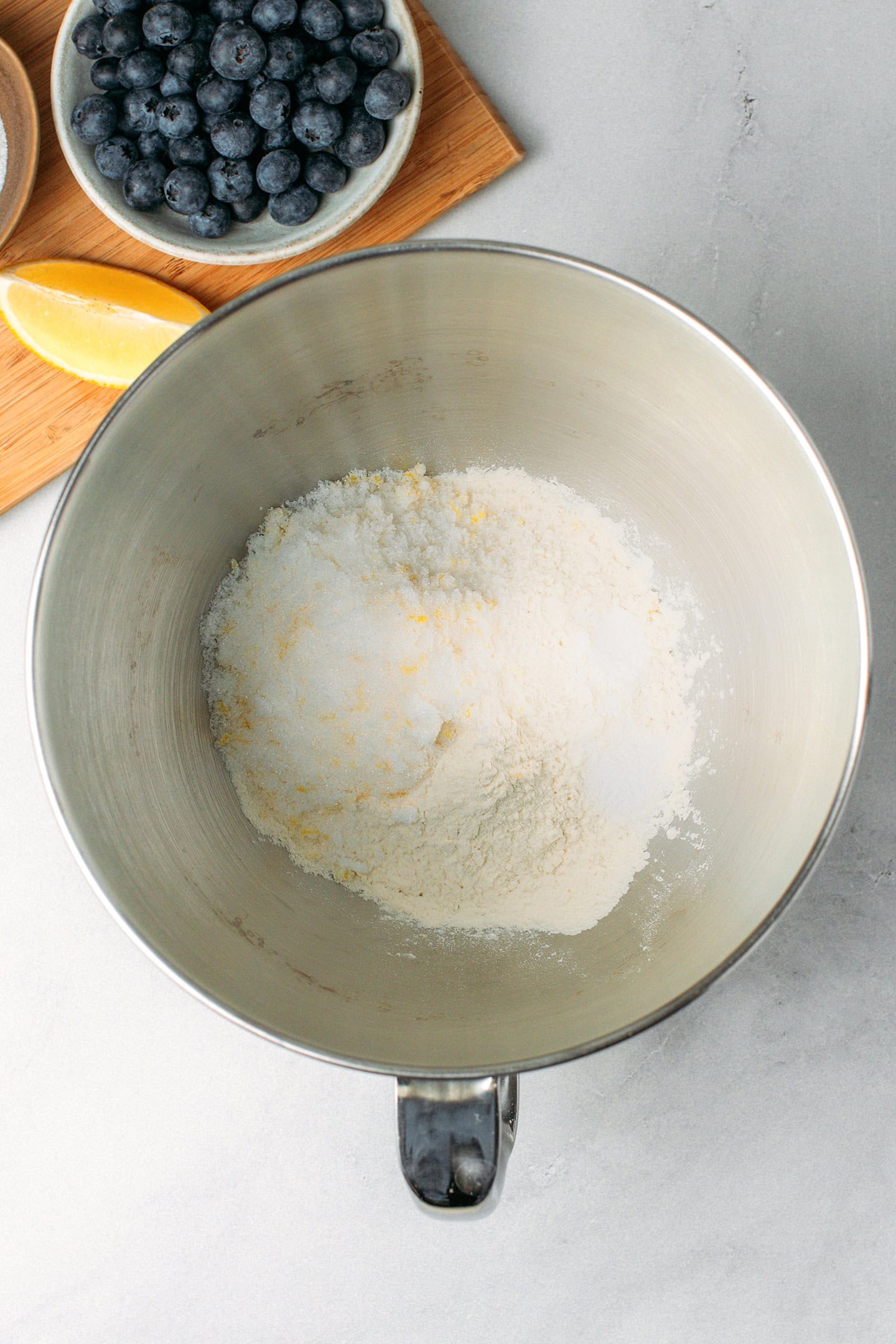 Lemon sugar, flour, and salt in a stand mixer bowl.