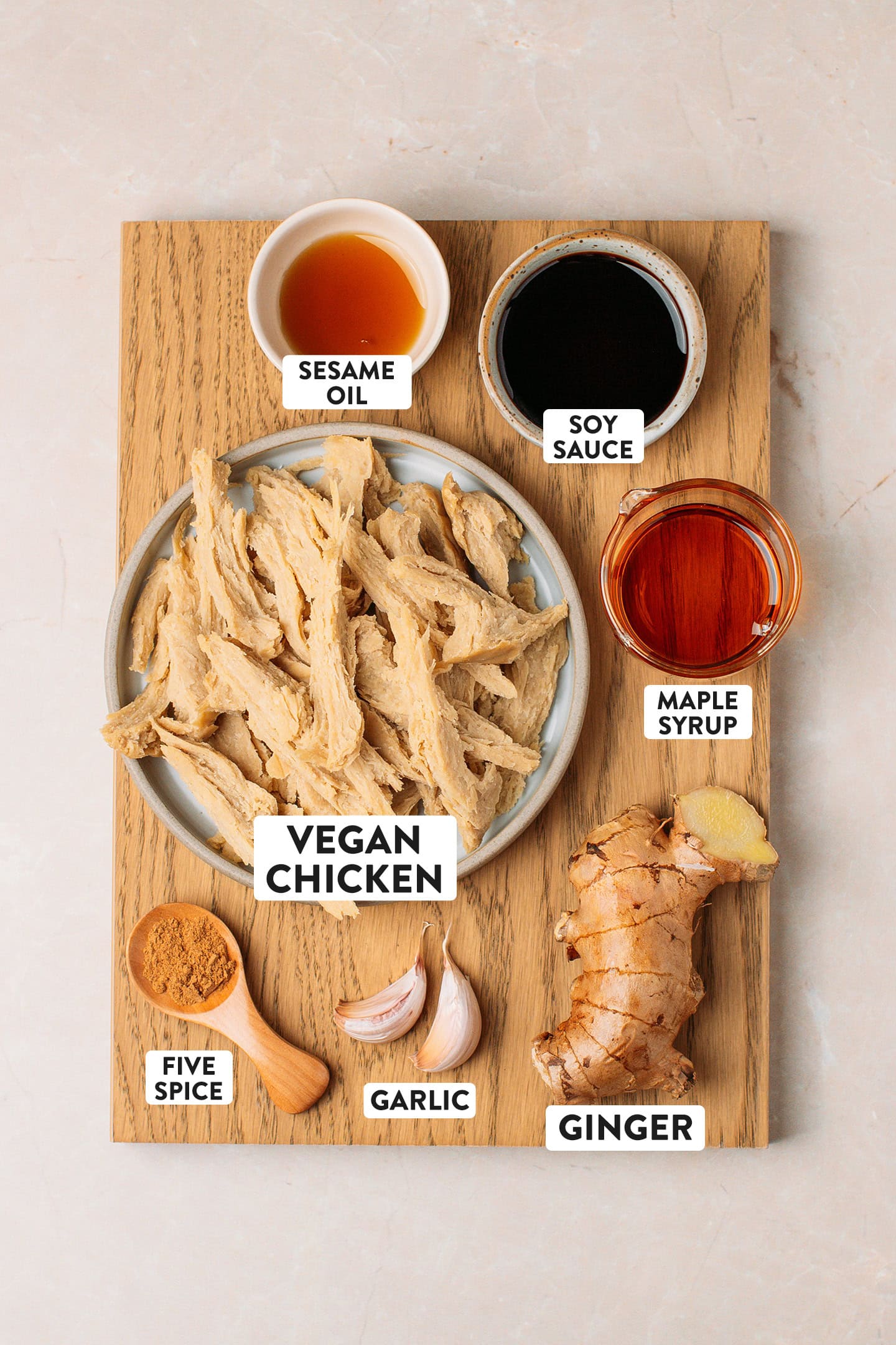 Ingredients like vegan chicken, ginger, garlic, maple syrup, and soy sauce.