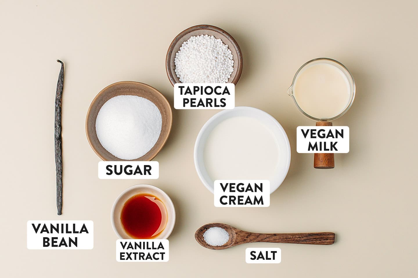 Ingredients like sugar, vegan cream, milk, vanilla extract, and vanilla bean.