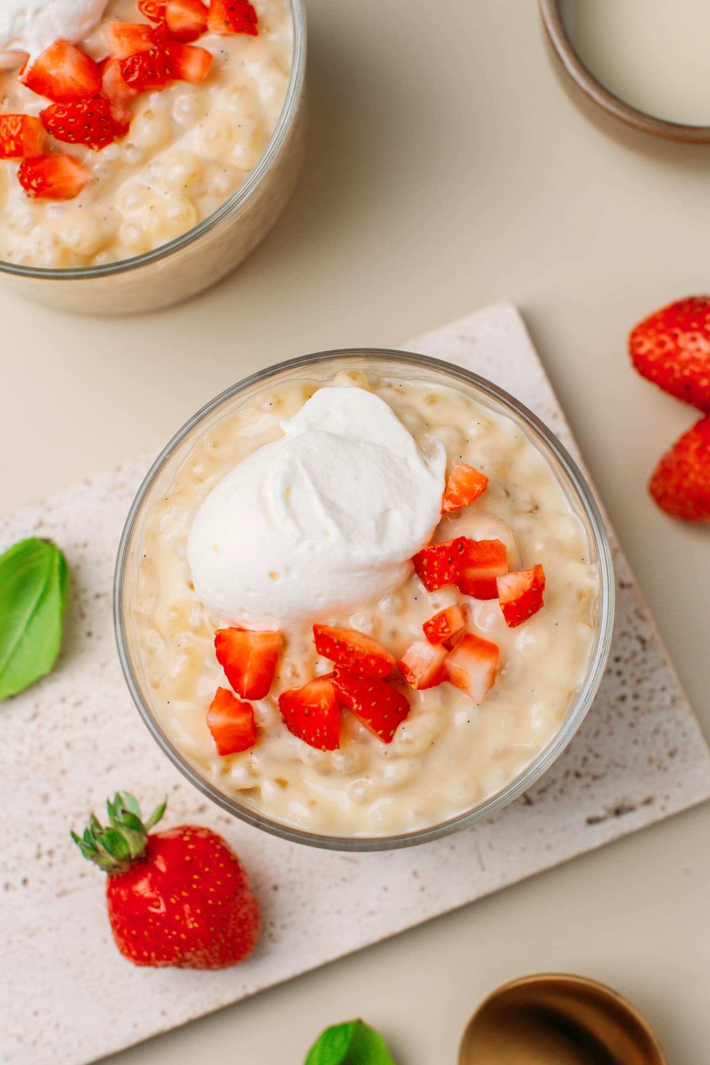 Top view of a vanilla tapioca pudding garnished with chopped strawberries.