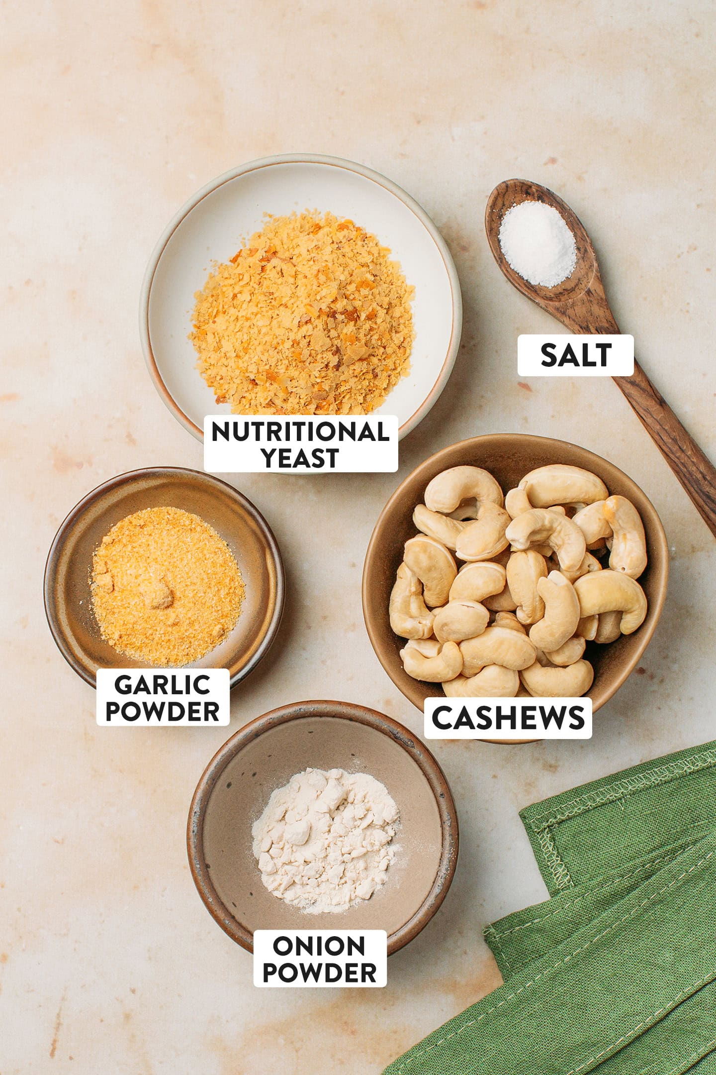 Ingredients like nutritional yeast, cashews, garlic powder, and onion powder.