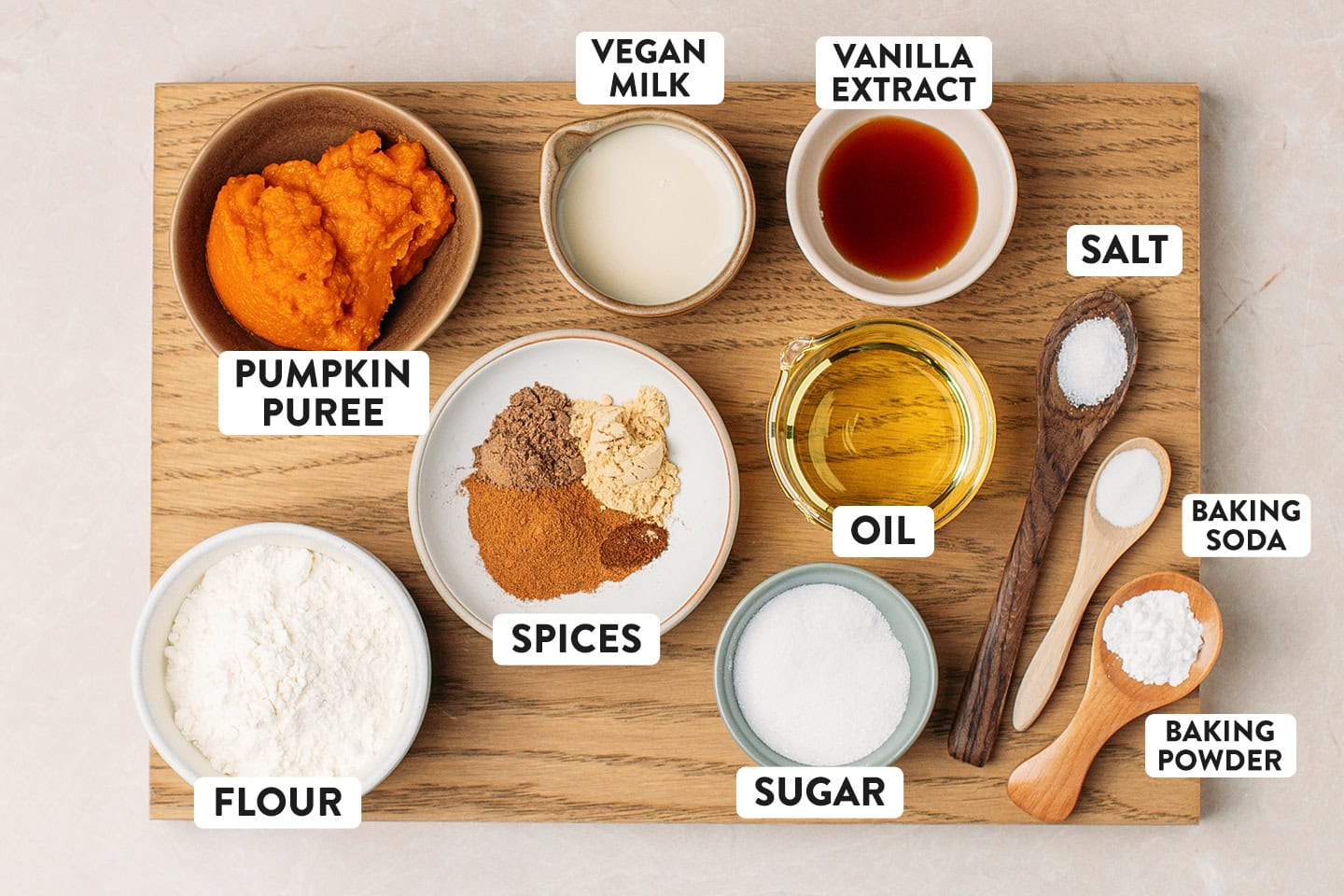 Ingredients like pumpkin purée, flour, spices, oil, and sugar.